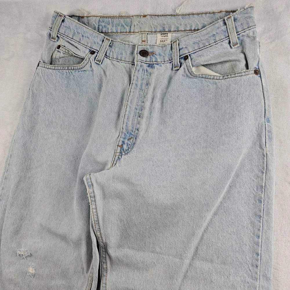 Vtg Levi's 560 Orange Tab Jeans 34x29 90s USA Loose Tapered Light Wash Raw Hem